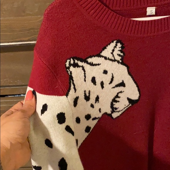 burgundy sweater with white leopards on sleeves. - Picture 2 of 2